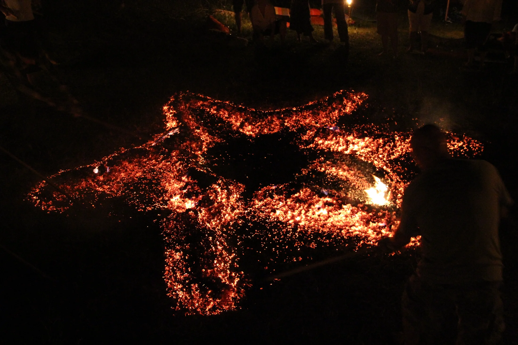 A carefully prepared ember path shaped into a radiant symbol