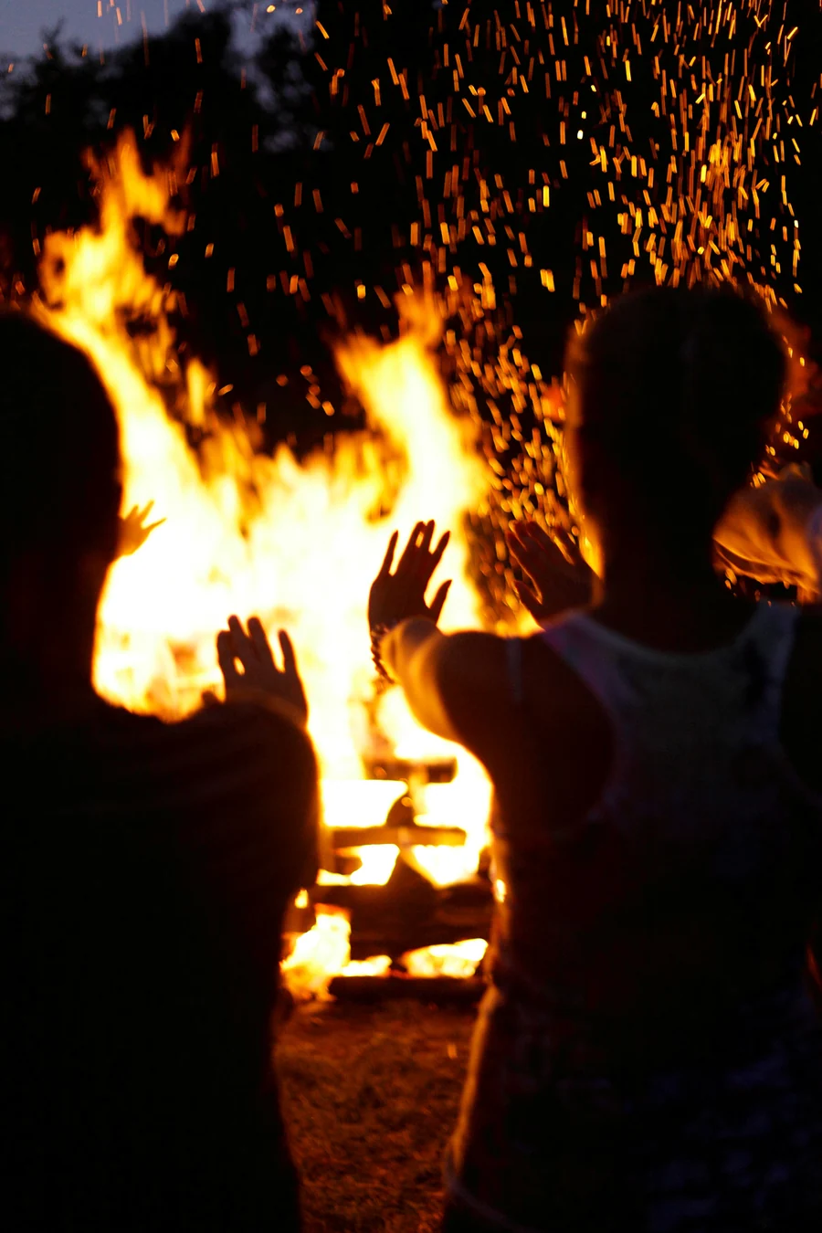 Corporate team sharing a firewalking event