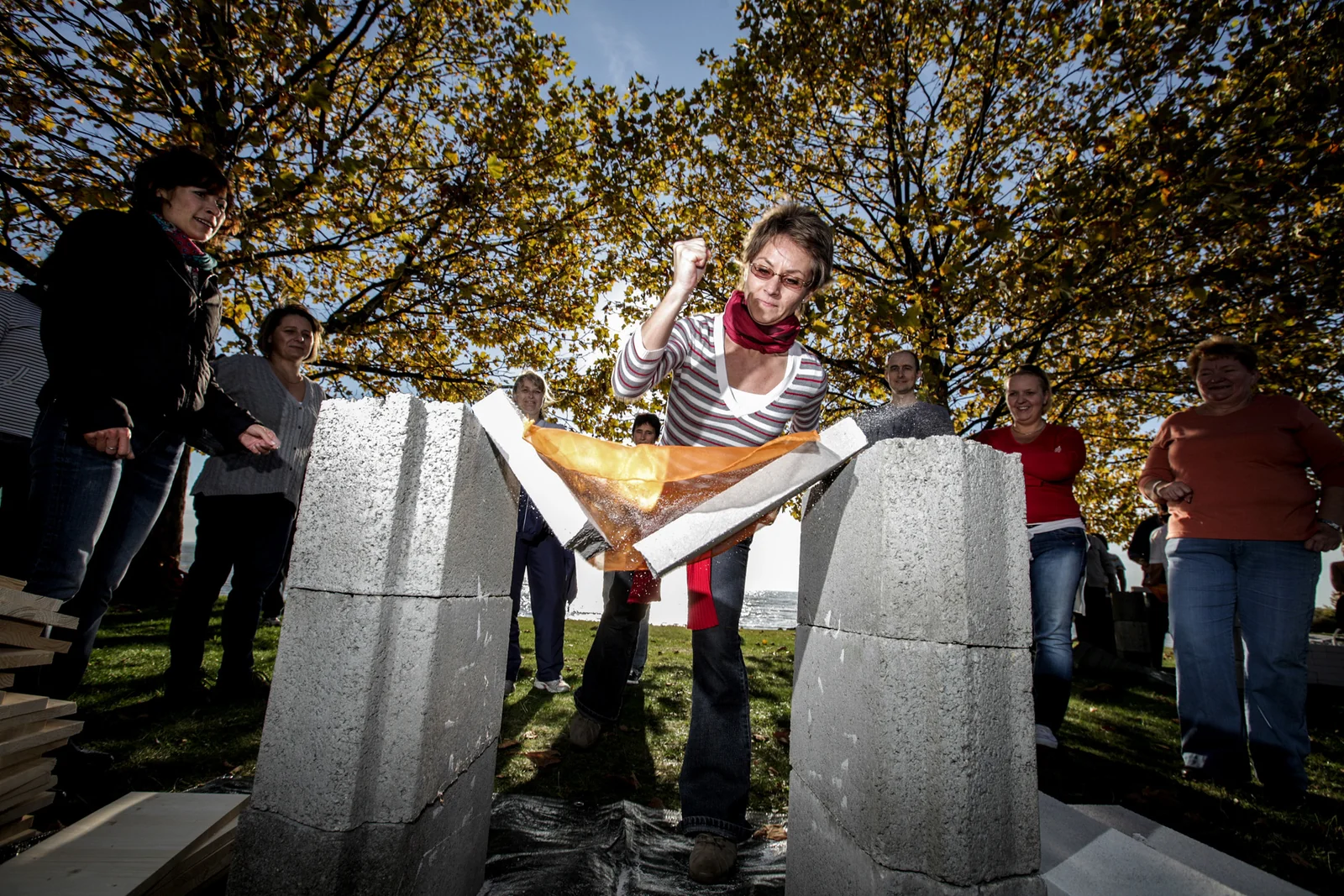 A woman breaking a brick during a breakthrough exercise