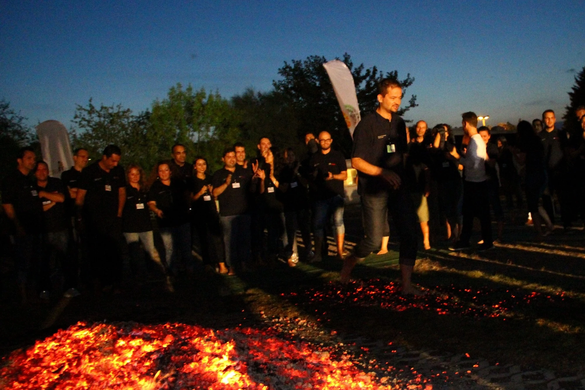 A large international corporate group gathered around a Napkapu firewalk in Istanbul